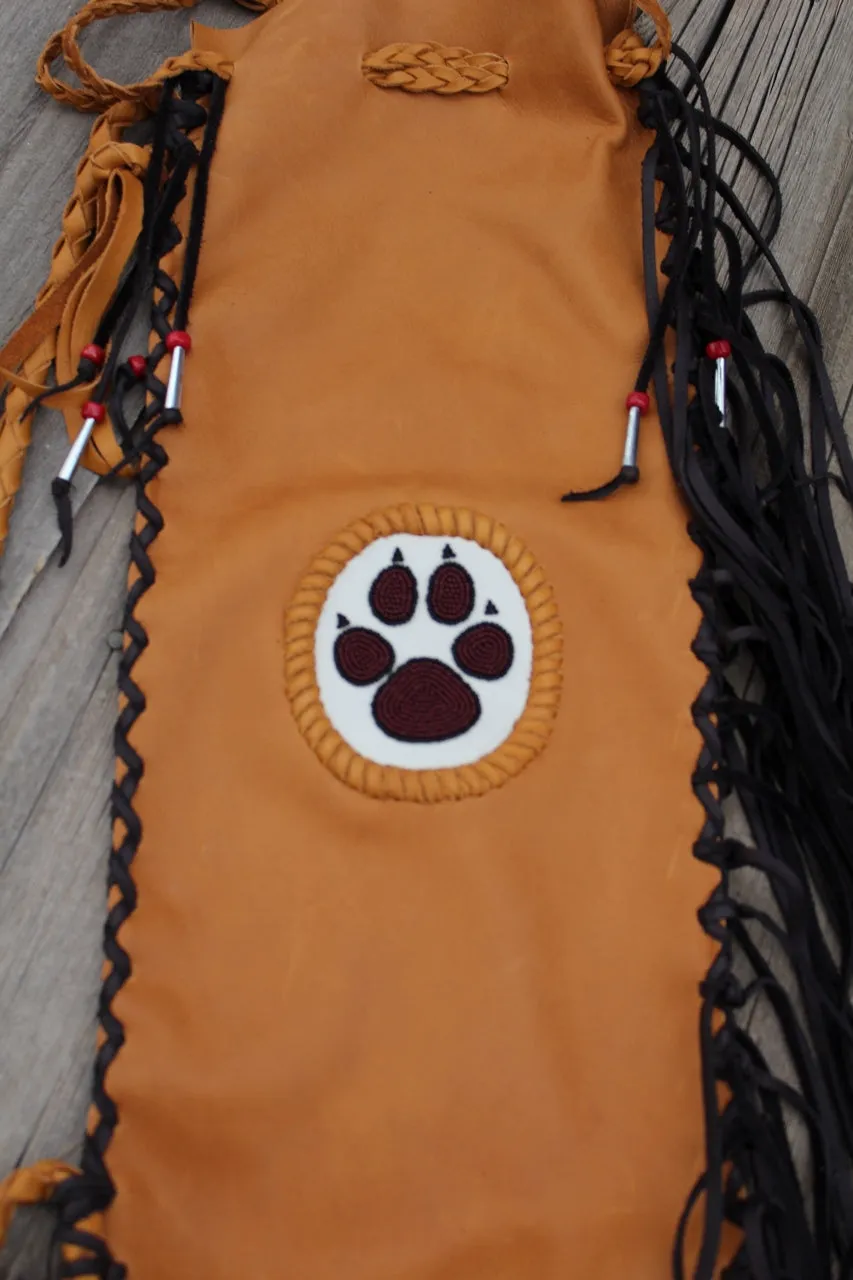 Fringed pipe bag with a beaded wolf paw, chanupa bag